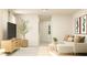 Cozy living room with a comfy white couch and a view into the hallway at 1011 Red Roses Ave, Durham, NC 27703