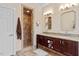 Updated bathroom featuring double vanities, tiled shower, and modern fixtures at 105 Fifemoor Ct, Cary, NC 27518