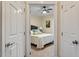 Comfortable bedroom with neutral tones, carpet, ceiling fan, and serene wall art at 105 Fifemoor Ct, Cary, NC 27518