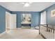 Bedroom offers blue walls, hardwood floors, ample space, and a built-in vanity at 105 Fifemoor Ct, Cary, NC 27518