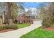Charming two-story brick home with a well-manicured lawn and an inviting driveway at 105 Fifemoor Ct, Cary, NC 27518