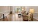 Bright and airy living room boasting hardwood floors, bay window, and ample seating at 105 Fifemoor Ct, Cary, NC 27518