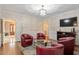 Inviting living room with hardwood floors, recessed lighting, and comfortable seating arrangement at 105 Fifemoor Ct, Cary, NC 27518