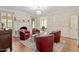 Relaxing living room with fireplace, hardwood floors, recessed lights, and comfortable seating at 105 Fifemoor Ct, Cary, NC 27518