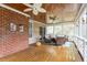 Inviting screened porch with wood ceiling, fan, and comfortable wicker furniture at 105 Fifemoor Ct, Cary, NC 27518
