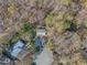 Overhead view of a home surrounded by lush trees in a neighborhood featuring mature landscaping and ample greenery at 109 Boulder Ln, Chapel Hill, NC 27514