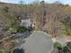 Aerial view of a charming home nestled in a wooded cul-de-sac offering privacy and a serene setting at 109 Boulder Ln, Chapel Hill, NC 27514