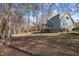Large backyard showing the green space and trees behind the house at 109 Boulder Ln, Chapel Hill, NC 27514