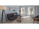 Bright living room with ample natural light, modern furniture, and minimalist decor at 109 Boulder Ln, Chapel Hill, NC 27514