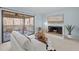 Inviting living room featuring a fireplace, comfortable seating, and access to an outdoor deck at 109 Boulder Ln, Chapel Hill, NC 27514