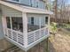 Cozy screened porch with white railing, perfect for enjoying the outdoor scenery at 109 Boulder Ln, Chapel Hill, NC 27514