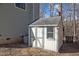 Outdoor shed with double doors and a window provides extra storage at 109 Boulder Ln, Chapel Hill, NC 27514