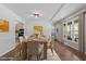 Elegant dining room with a wooden table, stylish chairs, and natural light, perfect for entertaining guests at 1107 Edgebrook Dr, Garner, NC 27529