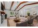 Spacious living room featuring a fireplace, modern lighting, and an open floor plan at 1107 Edgebrook Dr, Garner, NC 27529