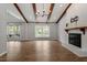 Open living space with a fireplace, hardwood floors, and ample natural light, ideal for gatherings at 1107 Edgebrook Dr, Garner, NC 27529