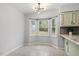 Sun-filled breakfast nook area featuring large windows that provide ample natural light at 1107 Edgebrook Dr, Garner, NC 27529