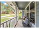 Inviting covered porch with seating area, perfect for enjoying the outdoors and neighborhood views at 1107 Edgebrook Dr, Garner, NC 27529
