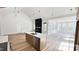 Modern kitchen with quartz counters, stainless appliances, and large island at 120 Sequoia Dr, Louisburg, NC 27549