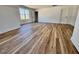 Spacious living room featuring wood-look flooring, recessed lighting, and natural light at 120 Sequoia Dr, Louisburg, NC 27549