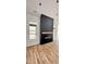 Contemporary fireplace with wooden beam and hardwood floors at 120 Sequoia Dr, Louisburg, NC 27549