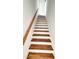 Stairway with wooden treads and risers with white painted accents at 120 Sequoia Dr, Louisburg, NC 27549