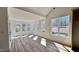 Bright sunroom with large windows and wood floors at 120 Sequoia Dr, Louisburg, NC 27549
