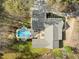 Aerial shot of home with a large backyard pool, patio, and driveway at 120 Teasel Ct, Clayton, NC 27527