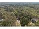 Panoramic aerial view showcasing the lush, tree-filled surroundings and the home's secluded location at 120 Teasel Ct, Clayton, NC 27527