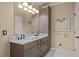 Bathroom featuring a large vanity, marble countertop, and framed mirror at 120 Teasel Ct, Clayton, NC 27527