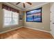 Bedroom with hardwood floors, a ceiling fan, and natural light from the window at 120 Teasel Ct, Clayton, NC 27527