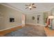 Large room featuring hardwood floors, tray ceilings, and neutral walls at 120 Teasel Ct, Clayton, NC 27527