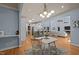 An open-concept layout that seamlessly connects the dining area with the kitchen and living room at 120 Teasel Ct, Clayton, NC 27527