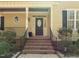 Close up of a home entrance featuring a brick walkway and stairs with beautiful landscaping at 120 Teasel Ct, Clayton, NC 27527