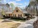 Beautiful home featuring a winding walkway, lush landscaping, and inviting curb appeal at 120 Teasel Ct, Clayton, NC 27527