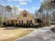 Charming one-story home with a covered porch, manicured lawn, and mature trees offering great curb appeal at 120 Teasel Ct, Clayton, NC 27527