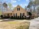 Charming single-story home with a covered front porch, manicured landscaping, and a side-entry carport at 120 Teasel Ct, Clayton, NC 27527