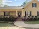 Charming home with a well-manicured lawn and welcoming front entrance at 120 Teasel Ct, Clayton, NC 27527