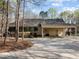 Spacious attached garage with multiple bays and ample parking on paved driveway at 120 Teasel Ct, Clayton, NC 27527