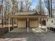 Detached two-car garage providing ample parking and storage, gravel driveway at 120 Teasel Ct, Clayton, NC 27527