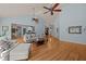 Spacious living room with hardwood floors, vaulted ceilings, and an open layout to the dining and kitchen at 120 Teasel Ct, Clayton, NC 27527
