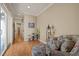 Cozy living room featuring hardwood floors, neutral walls, and comfortable seating at 120 Teasel Ct, Clayton, NC 27527