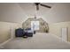 Living room in finished attic featuring carpeted floors and a plush blue couch at 120 Teasel Ct, Clayton, NC 27527
