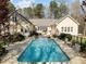 In-ground swimming pool with wrought-iron perimeter fencing at 120 Teasel Ct, Clayton, NC 27527