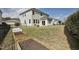 Lawn with garden beds, and the exterior of the two story home at 127 S Harrison Place Ln, Fuquay Varina, NC 27526