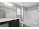 Bathroom featuring vanity with dual sinks, toilet, and shower-tub combo at 127 S Harrison Place Ln, Fuquay Varina, NC 27526