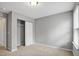 Bedroom featuring a closet with sliding doors, neutral walls and carpet at 127 S Harrison Place Ln, Fuquay Varina, NC 27526