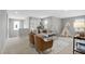 Upstairs bonus room with lots of natural light and seating at 127 S Harrison Place Ln, Fuquay Varina, NC 27526