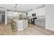 Stylish kitchen featuring granite counters, stainless appliances, an island with barstool seating, and ample cabinet space at 127 S Harrison Place Ln, Fuquay Varina, NC 27526