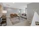 Cozy living room with modern furniture, area rug, and natural light at 127 S Harrison Place Ln, Fuquay Varina, NC 27526
