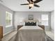 Comfortable main bedroom with natural light and a ceiling fan at 127 S Harrison Place Ln, Fuquay Varina, NC 27526